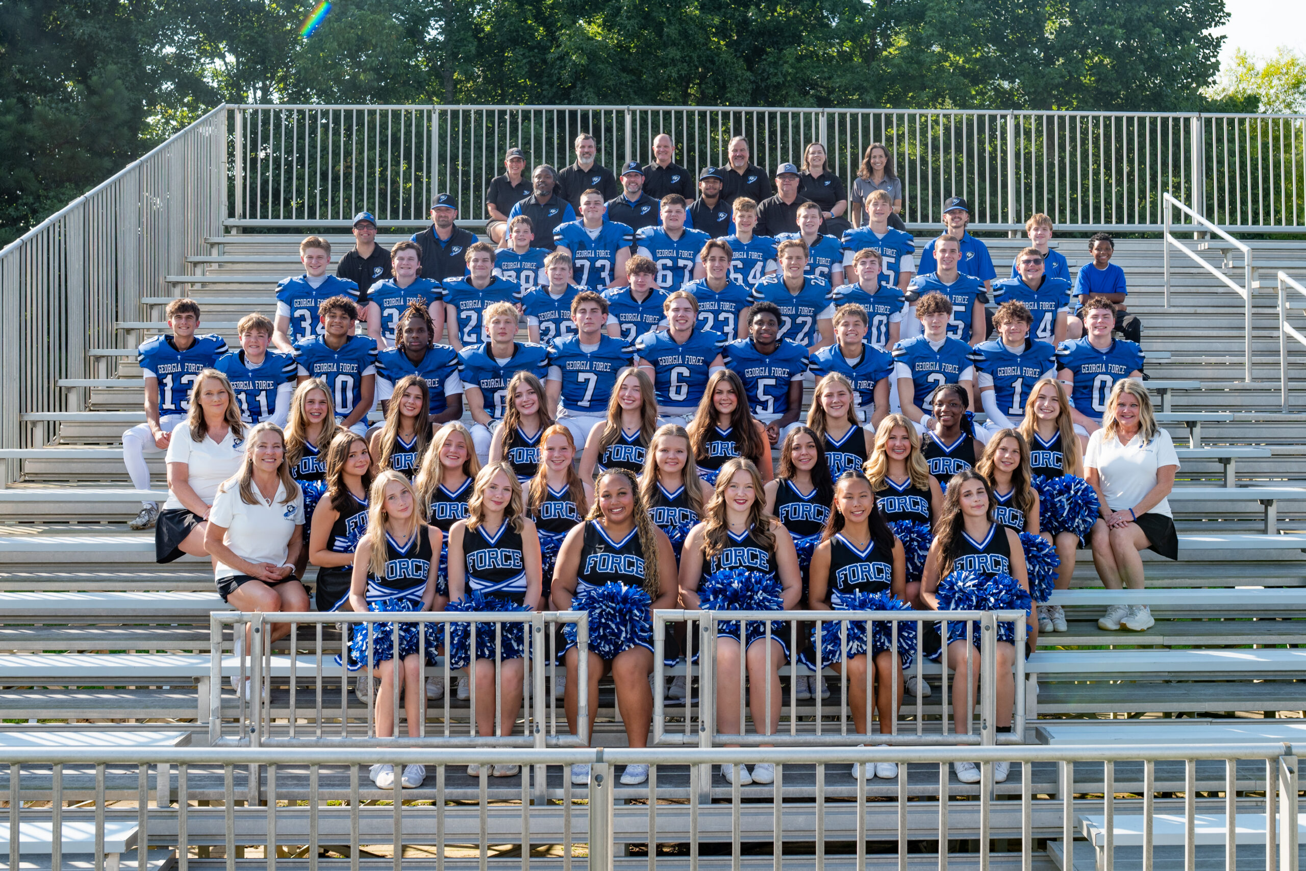 Georgia Force football and cheer teams on the bleachers